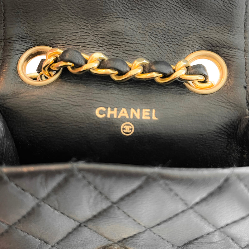 black chanel bag with black chain necklace